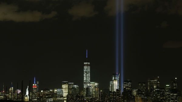The Tribute in Light rises above the New York skyline Friday, Sept. 11, 2015, in a view from Bayonne, N.J.