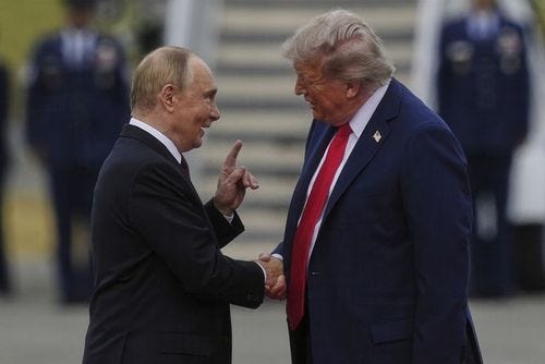 President Donald Trump greets Russia's President Vladimir Putin Friday, Aug. 15, 2025, at Joint Base Elmendorf-Richardson, Alaska