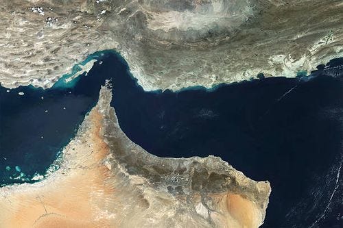 Satellite view of the Strait of Hormuz, a critical chokepoint for global energy supply, connecting the Persian Gulf to the Gulf of Oman. This vital...