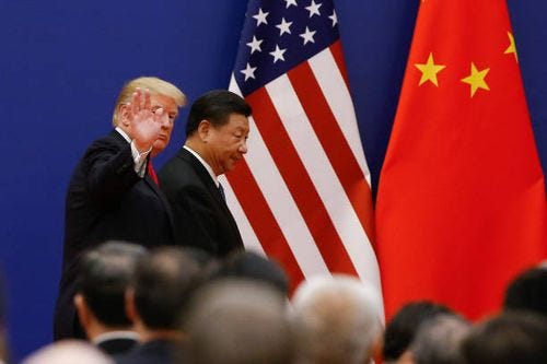 President Donald Trump and China's President Xi Jinping meet business leaders at the Great Hall of the People on November 9, 2017 in Beijing, China....